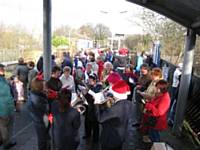 Crowds waiting on December 6th 2009 to join the Mince-Pie Special at Littleborough are entertained by the band and carol singers. Tony Young